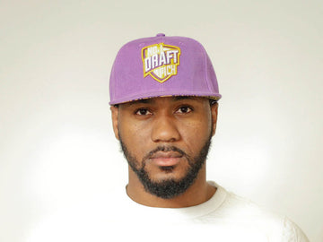 LA Lakers purple cap with embroidered logo, curved brim, and adjustable strap for unisex streetwear and fan gear
